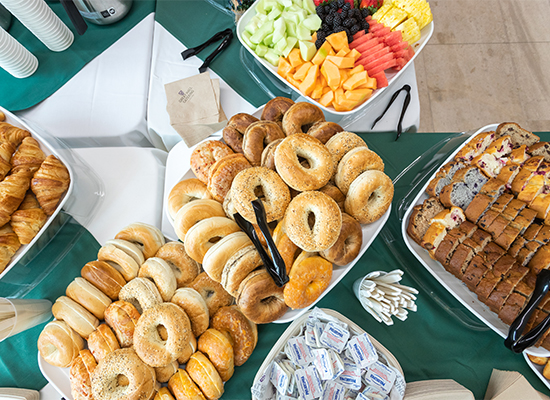 Assortment of pastries and fruits on buffet-style table