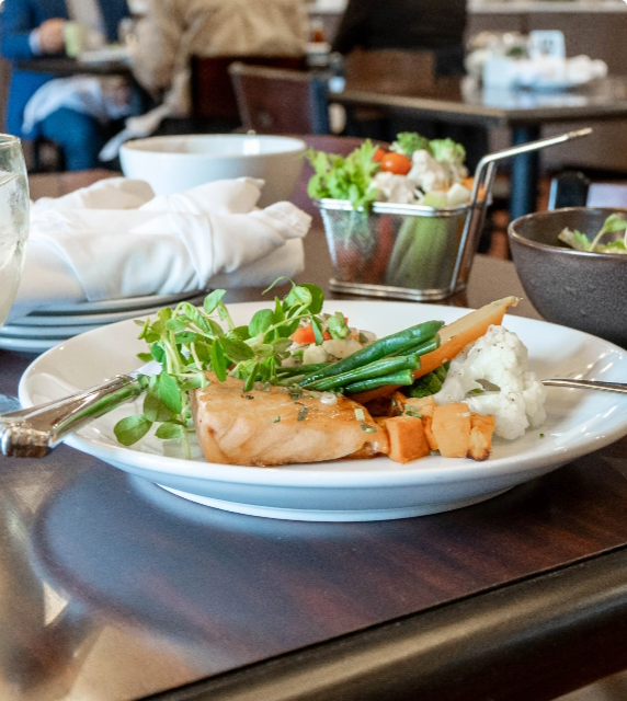 A plated meal of fish and vegetables