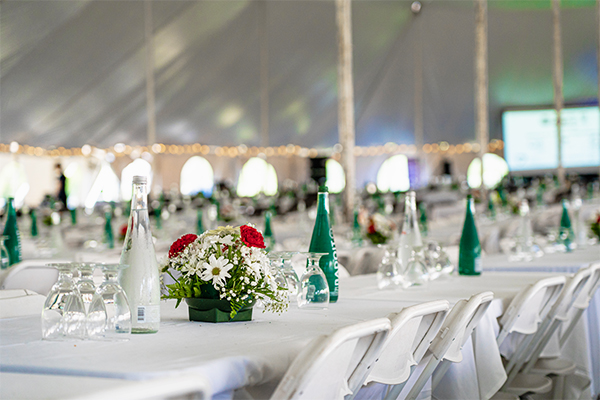 White linen tables and chairs in a tent