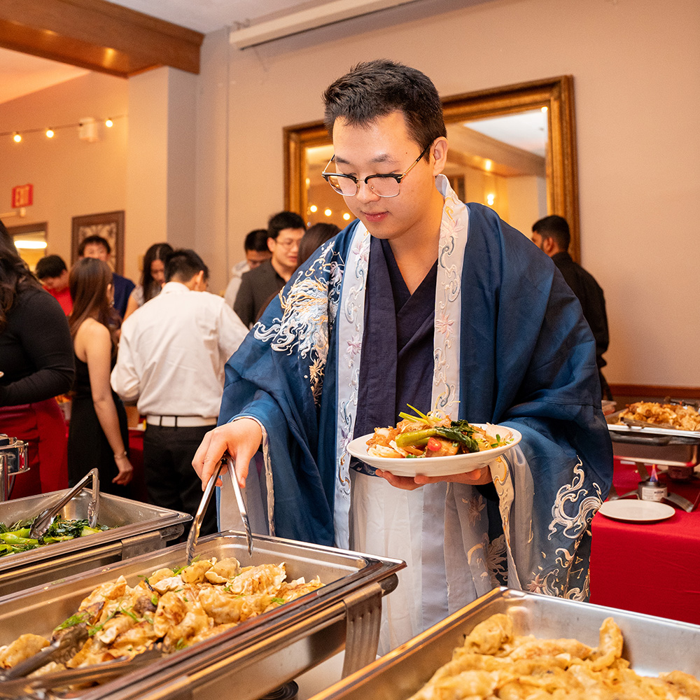 People serving themselves at a buffet