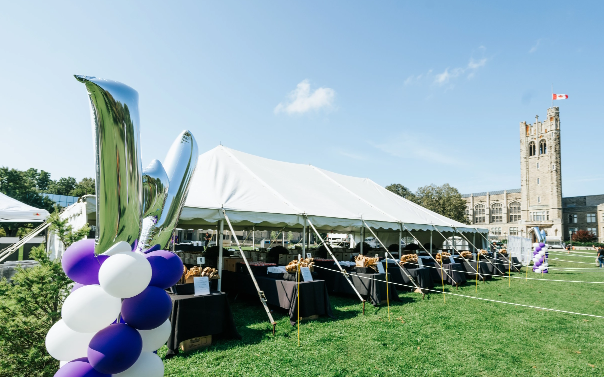 An outdoor tent on in front of UC Hill, Western University.